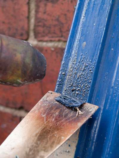 stripping paint off of door with a heat gun